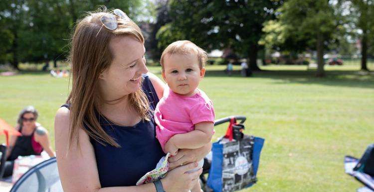 woman holding baby 