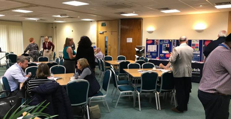 attendees talking to each other at annual meeting