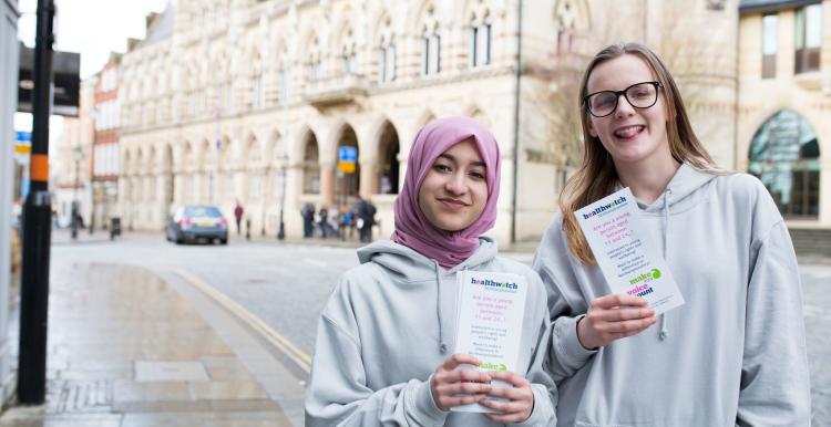 young healthwatch volunteers holding leaflets