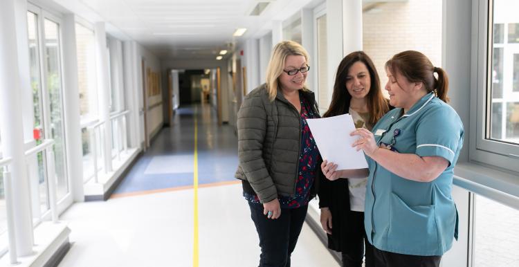 Women and nurse in hospital