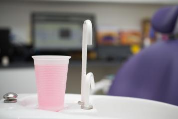 cup of mouthwash at dentist