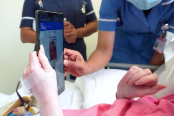 woman speaking to someone on the phone at hospital