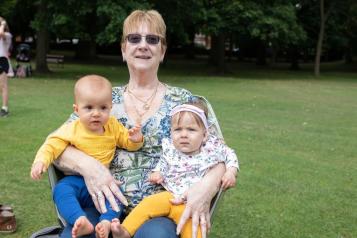 Woman holding 2 children