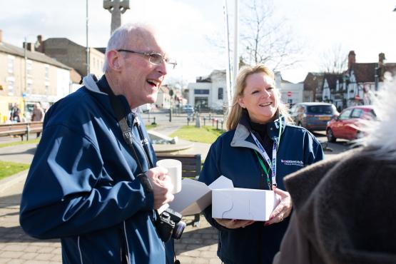 Volunteers speaking to member of the public
