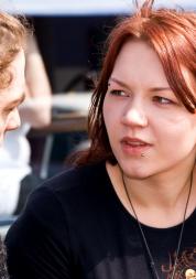 Young woman mid conversation with a young man